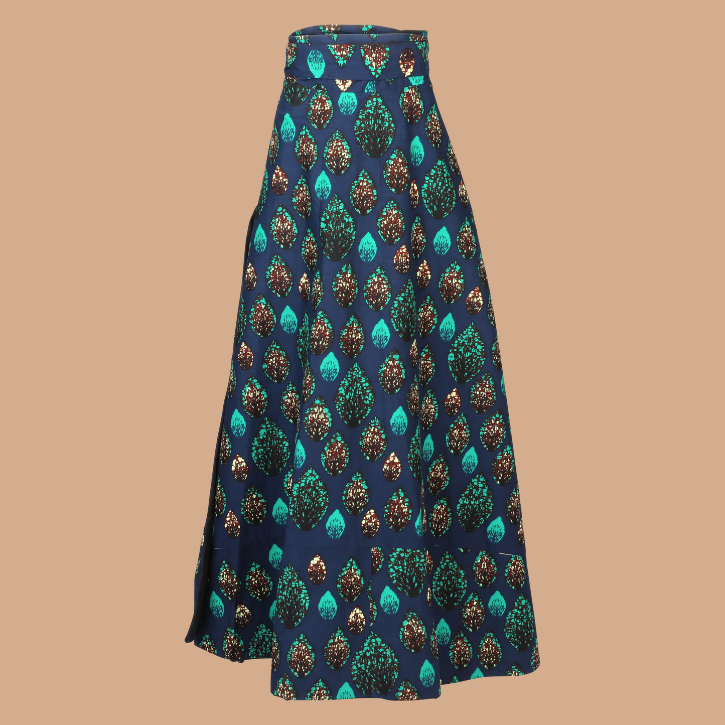 Model wearing Fea Reversible Wrap Skirt – high-waisted, ankle-length wrap skirt with African print on one side and solid black crepe on the other. One-size tie waist.