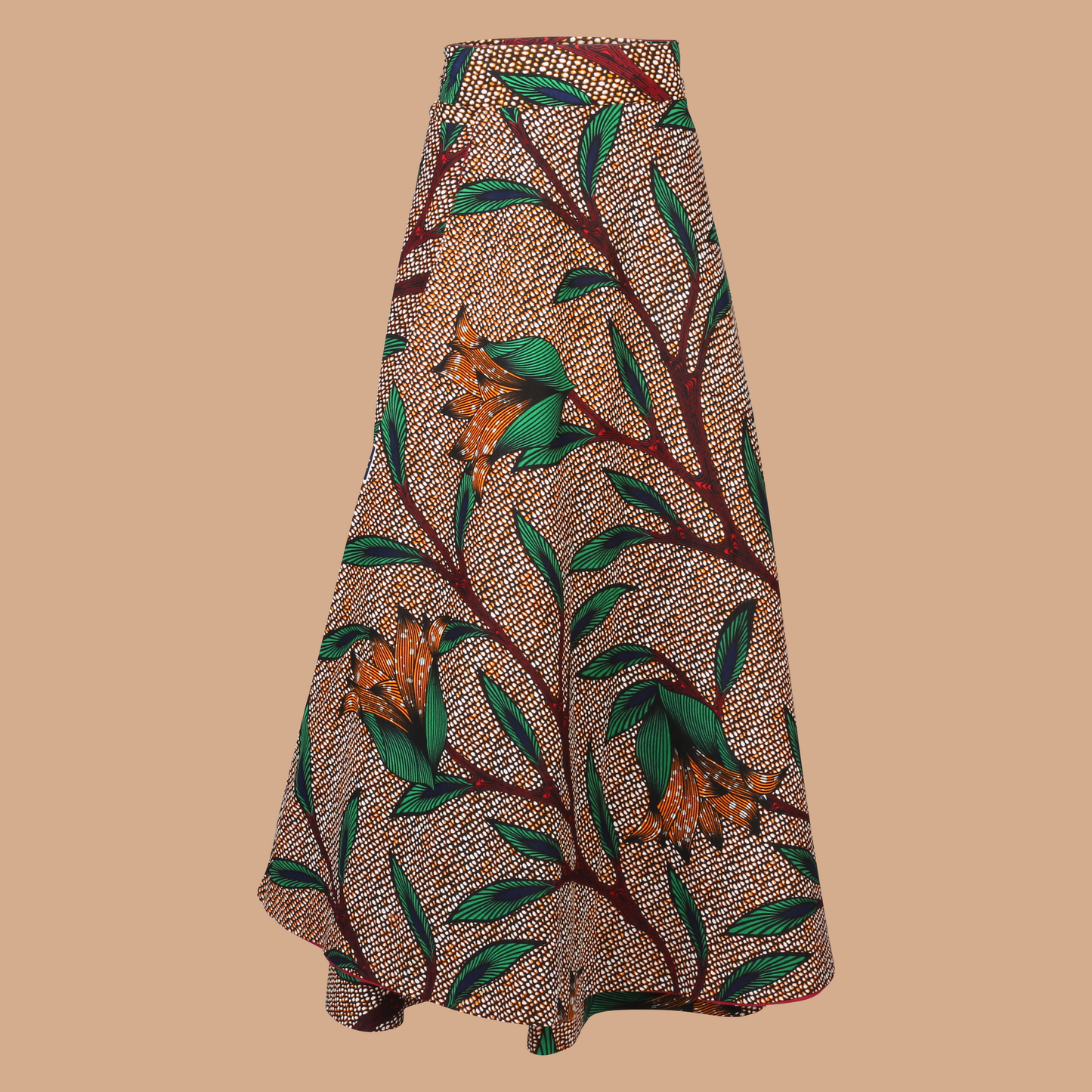 Model wearing Flora Reversible Wrap Skirt – high-waisted African print maxi skirt with tie waist and black reverse side, handmade in Nigeria
